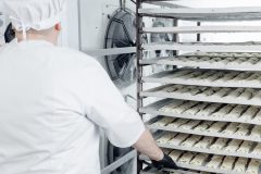 Confectionery production, placing puff pastry buns in freezer for shock freezing